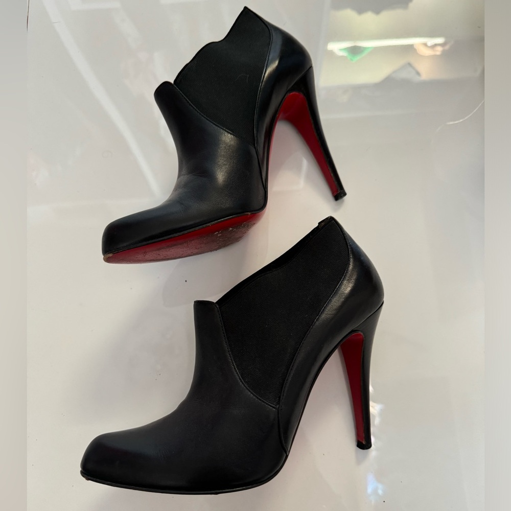 Christian Louboutin ankle leather boots .